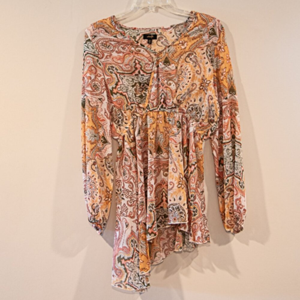 On twelfth Sheer flowy blouse with scalloped bottom and puffy sleeves